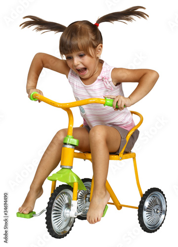 little girl driving bicycle