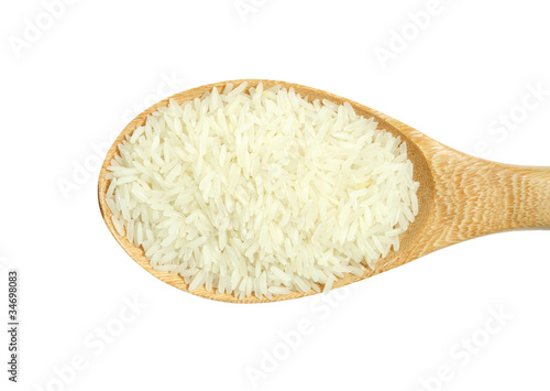 wooden spoon with rice isolated on white background