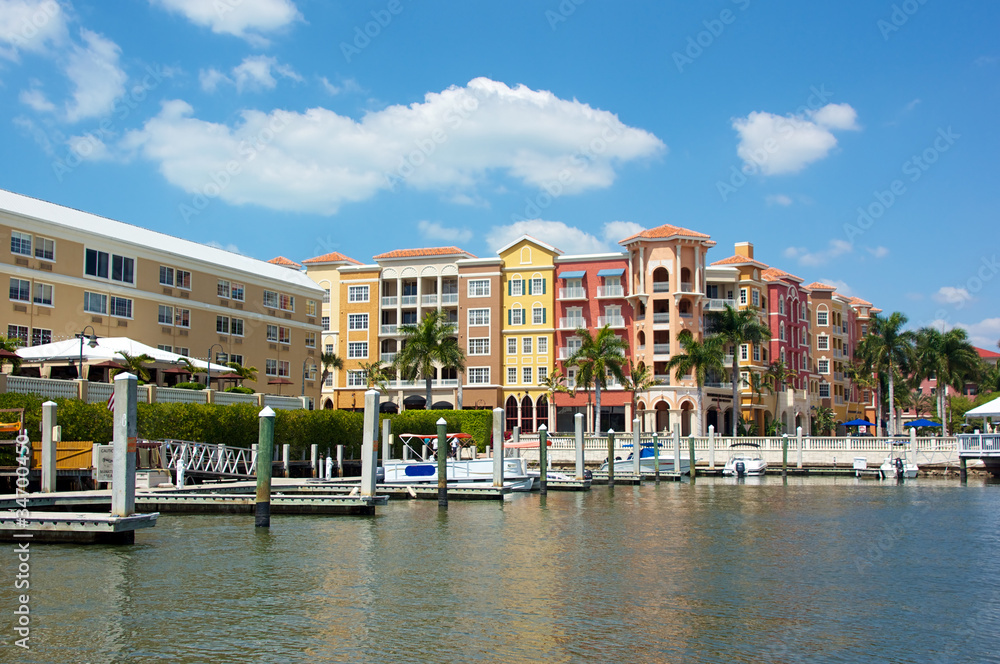 colorful tropical buildings overlooking water and piers