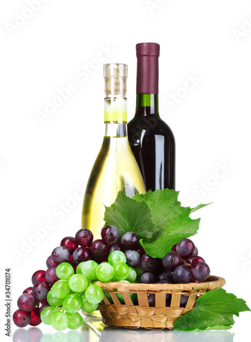 ripe green and red grapes in basket and wine isolated on white