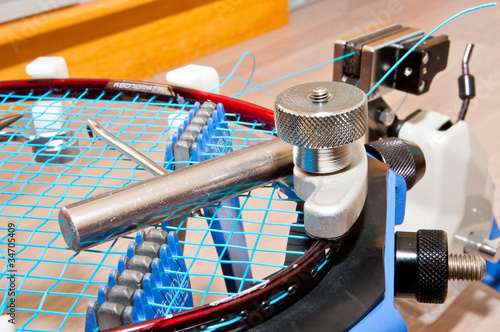 Stringing a badminton racket .