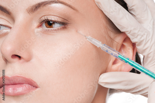 Cosmetic injection in woman's face