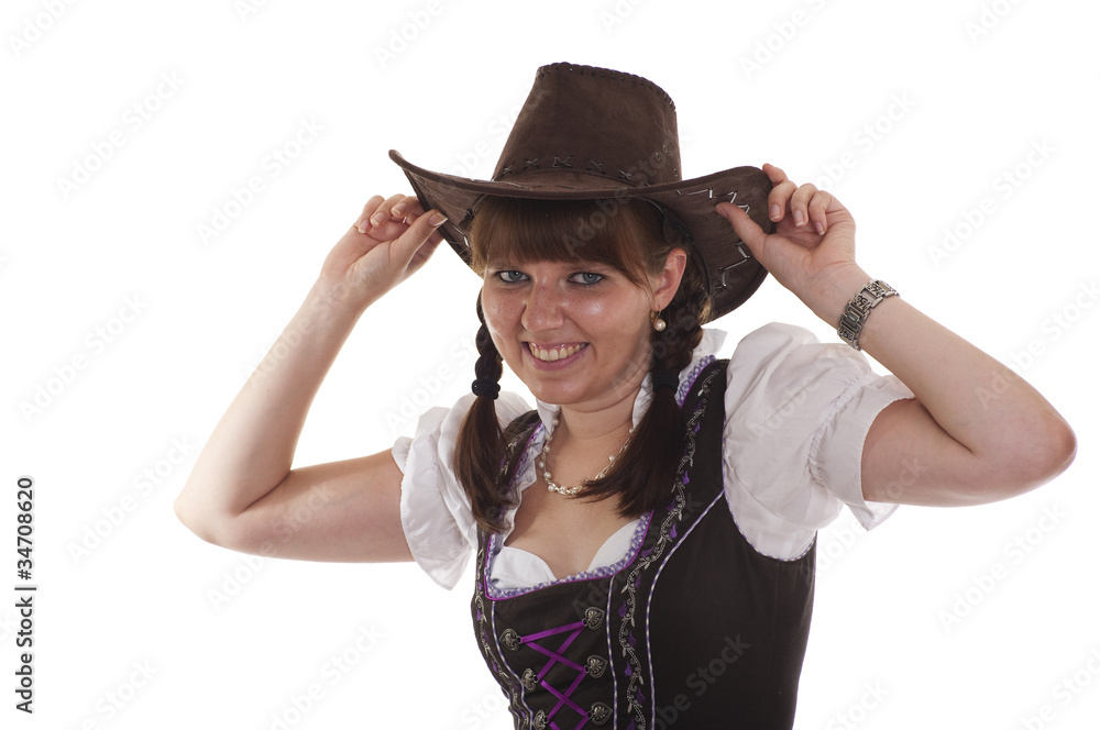 Frau in Tracht mit Cowboyhut Frau in Tracht mit Cowboyhut