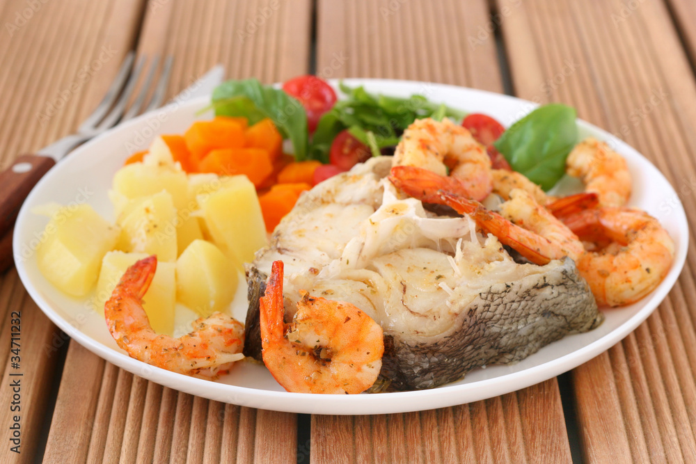 Boiled fish with shrimps and vegetables