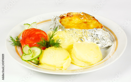 Baked Potato filled with meat and cheese on white plate