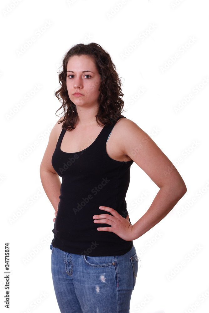 Young Brunette in Black Tank Top and Blue Jeans Hands on Hips to Young Brunette in Black Tank Top and Blue Jeans Hands on Hips to