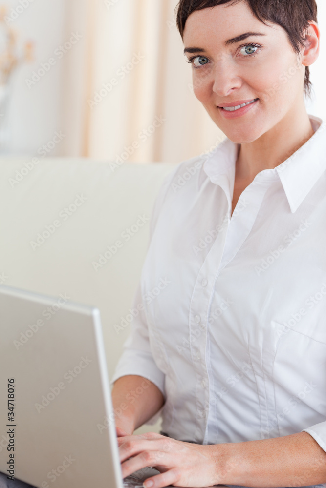 Close up of a woman with a laptop