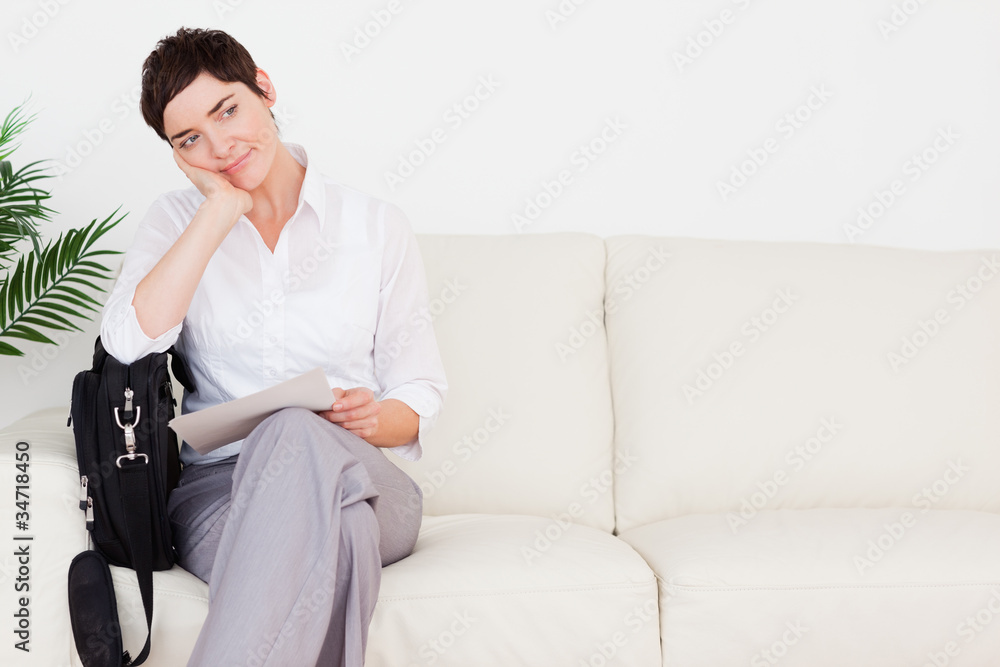 Upset Businesswoman with a paper and a bag Upset Businesswoman with a paper and a bag