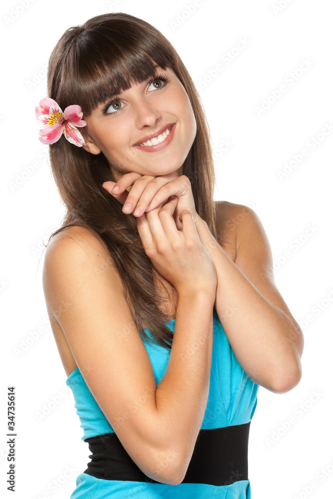 Portrait of young beautiful female with flower over ear Portrait of young beautiful female with flower over ear
