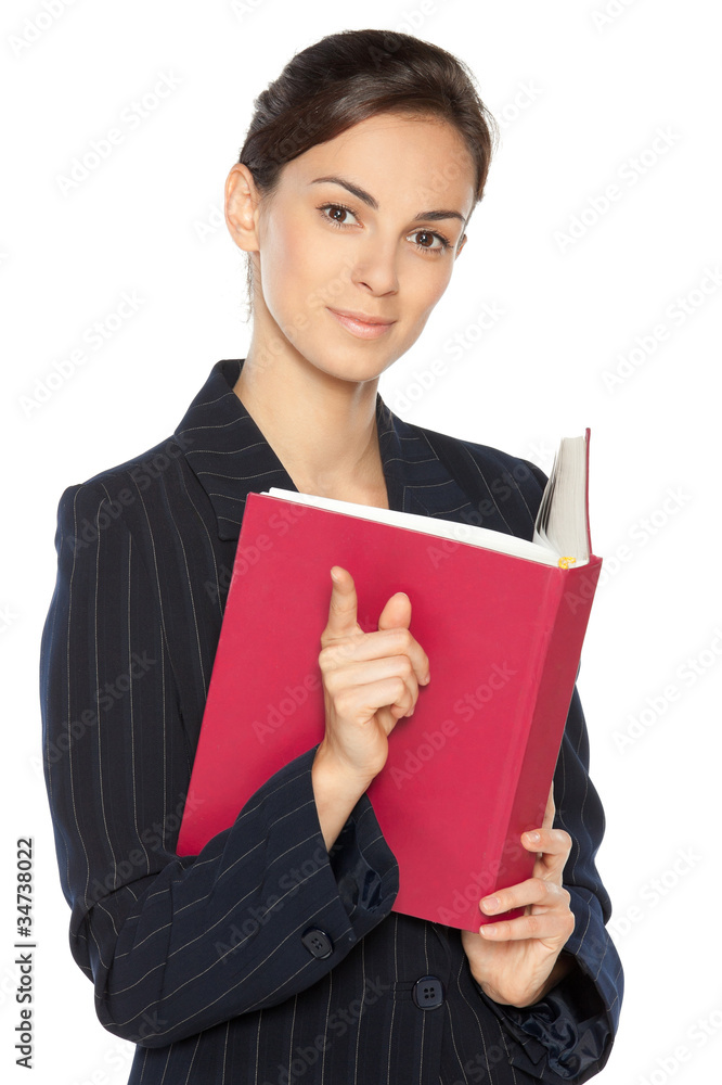 Young female teacher holding a book pointing at you Young female teacher holding a book pointing at you