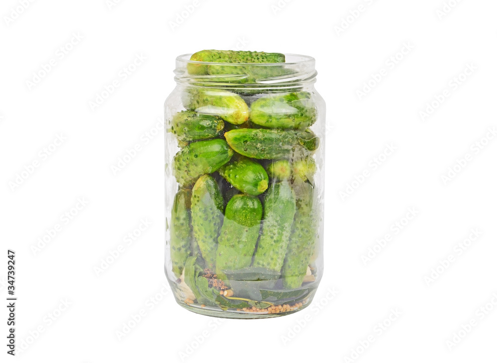 Glass jar with cucumber gherkin, isolated on white background