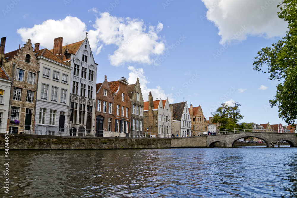 Fototapeta premium Bruges Canal, Homes And Clouds