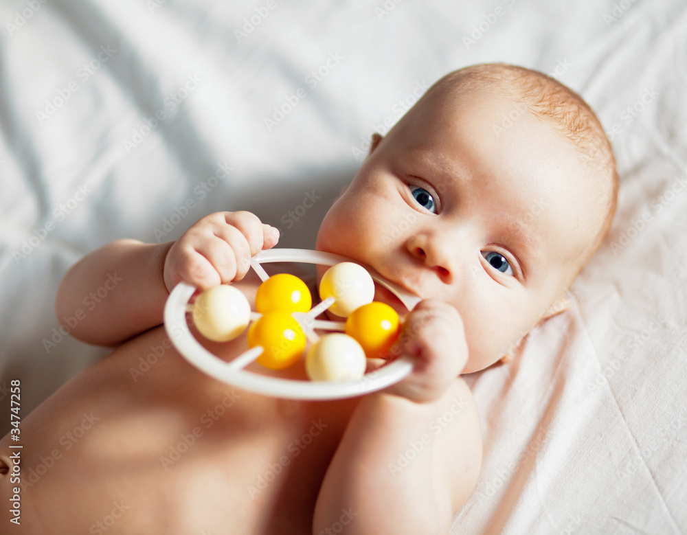 Picture of the newborn resting on a bed Picture of the newborn resting on a bed