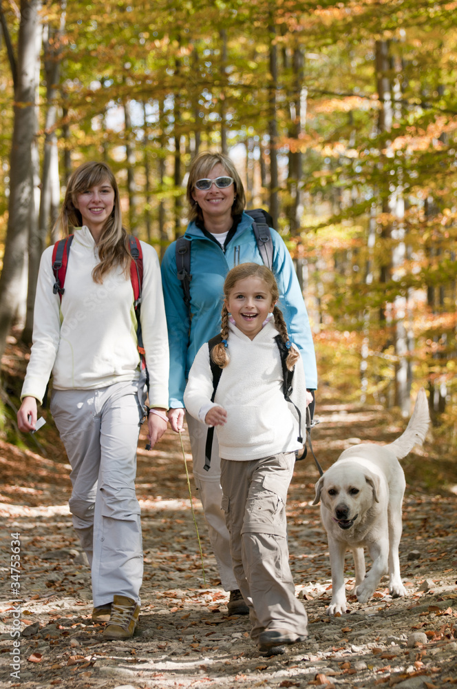 Autumn - Family with dog on autumn trek Autumn - Family with dog on autumn trek