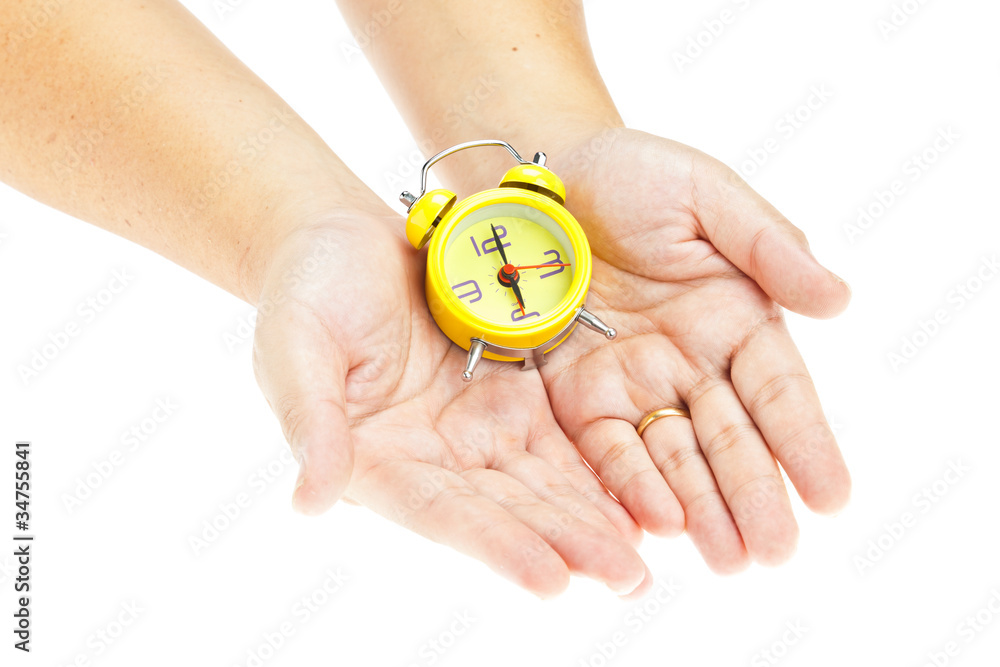 Clock on hand as time management concept Clock on hand as time management concept