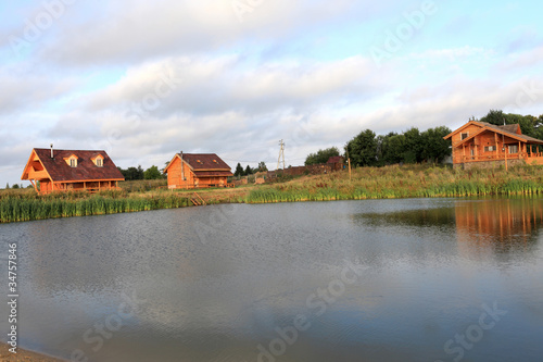 Cottages on the lakeside © Arkady Chubykin