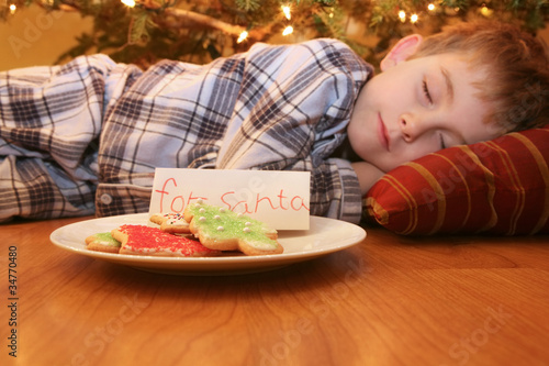 Sleeping boy waiting for Santa