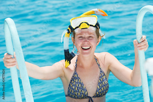 smiling woman with snorkel equipment