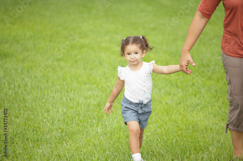 Child holding mothers hand