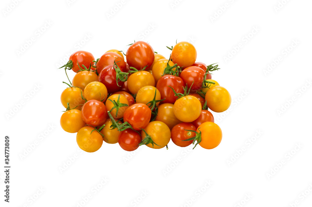 Red yellow and orange cherry tomatoes isolated on white
