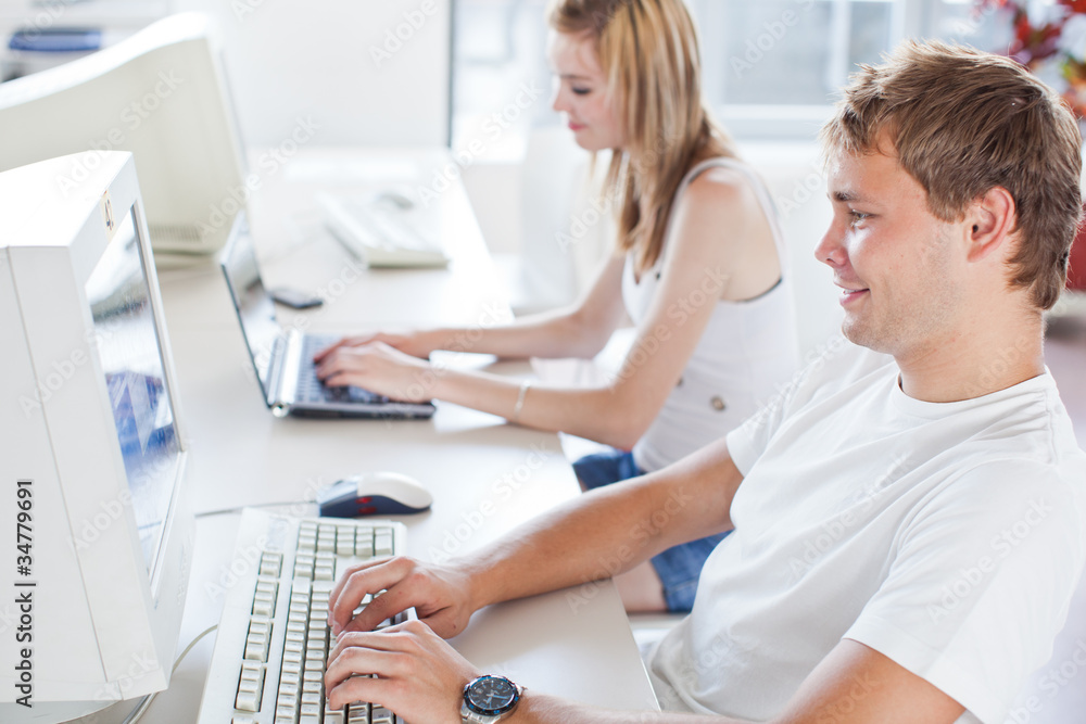 Fototapeta premium two college students having fun studying together