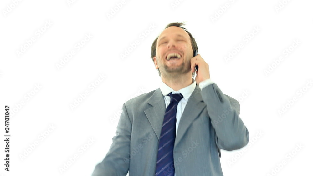 Exited businessman hearing great news on the phone, isolated Exited businessman hearing great news on the phone, isolated