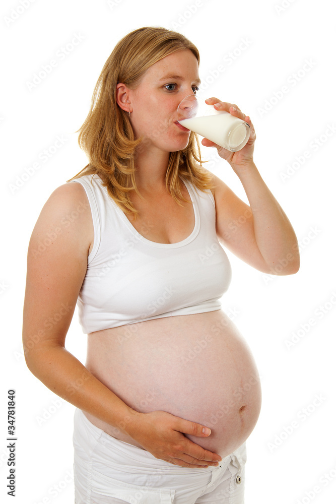 Pregant woman drinking milk Pregant woman drinking milk