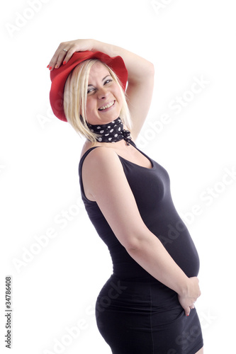 happy pregnant woman with red hat photo