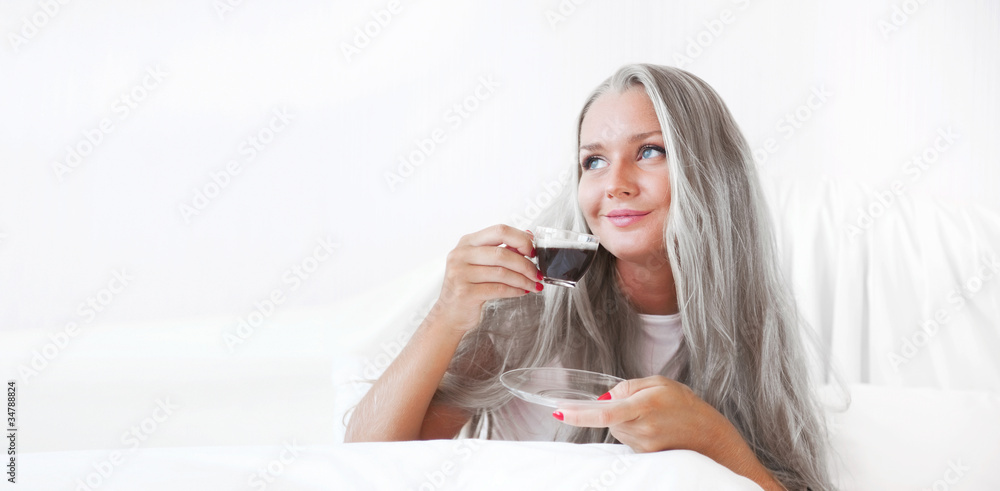 Closeup portrait of a pretty senior female having a cup of coffe