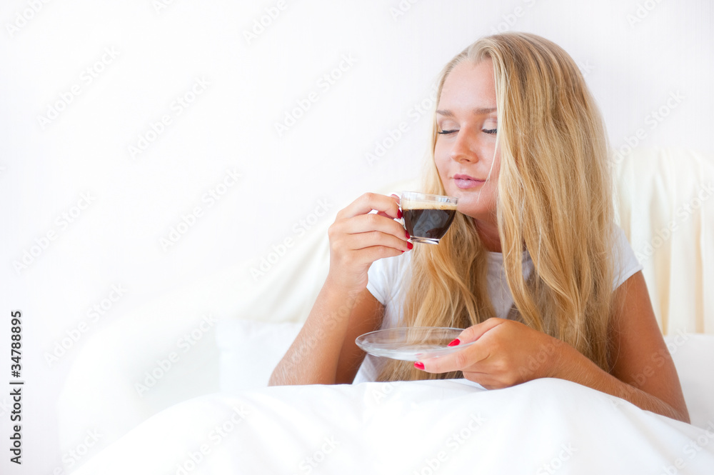 Closeup portrait of a pretty young female having a cup of coffee Closeup portrait of a pretty young female having a cup of coffee
