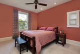 Master bedroom with peach colored walls