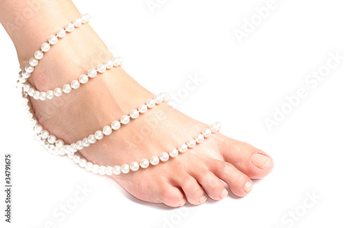 leg and pearls on a white background