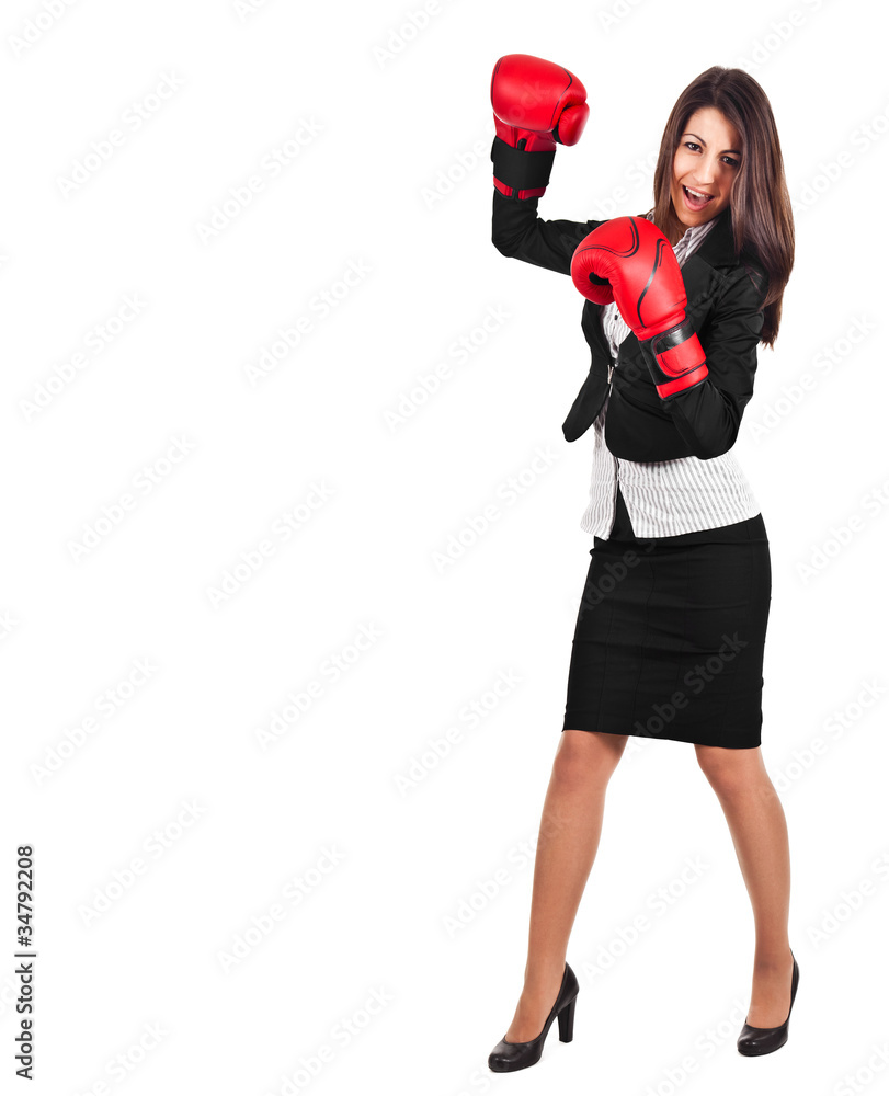 A business woman with boxing gloves punching A business woman with boxing gloves punching