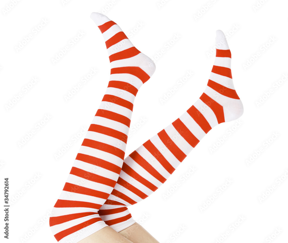 Christmas female legs, isolated on white background Christmas female legs, isolated on white background