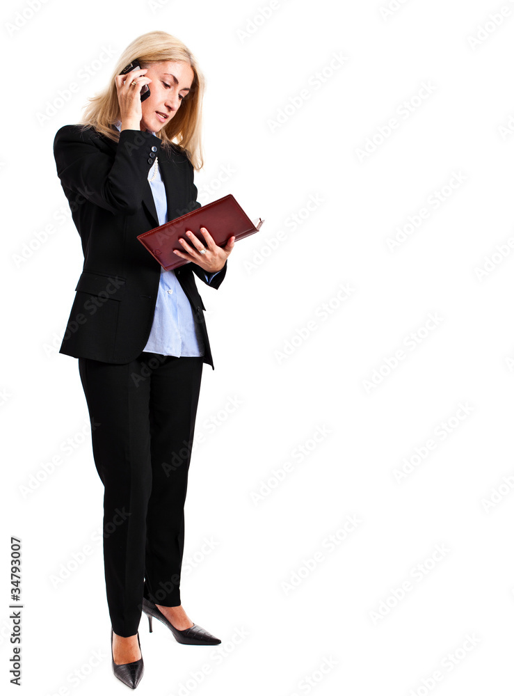 Full length businesswoman talking at the phone Full length businesswoman talking at the phone