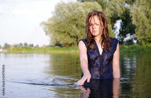 Fototapeta Weird clothed bather woman