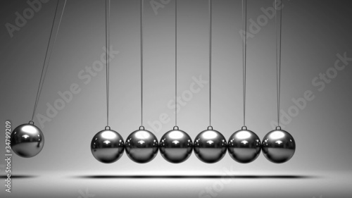 Balancing balls Newton's cradle on grey background