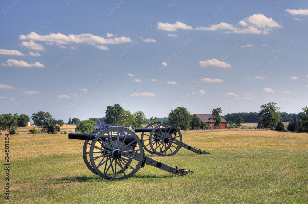 Two civil war era cannons in open field