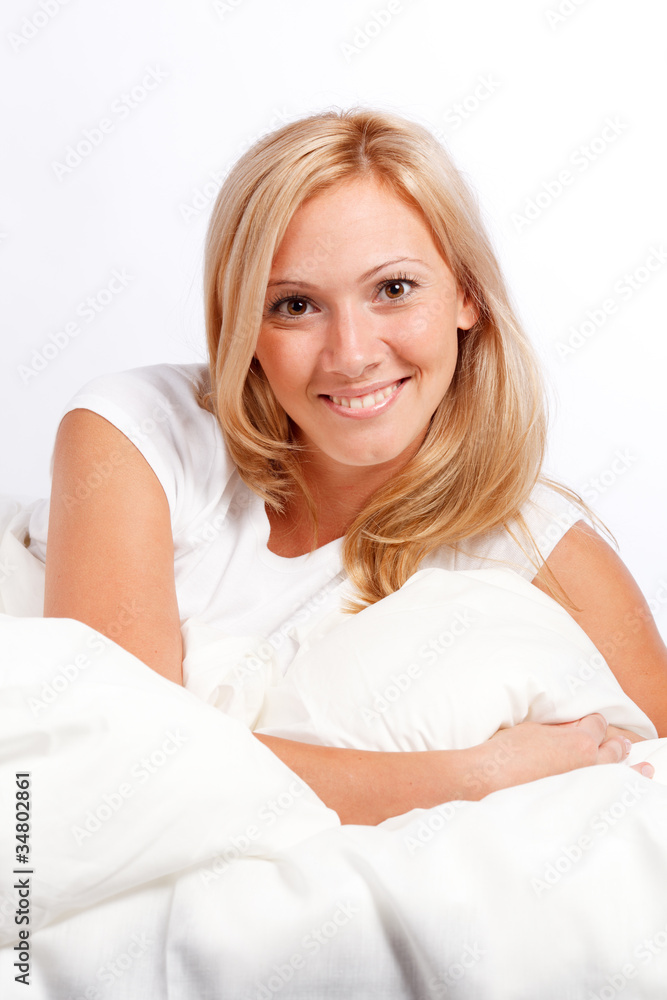 Young woman in bed. Young woman in bed.