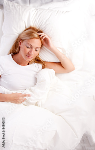 Young woman in bed.