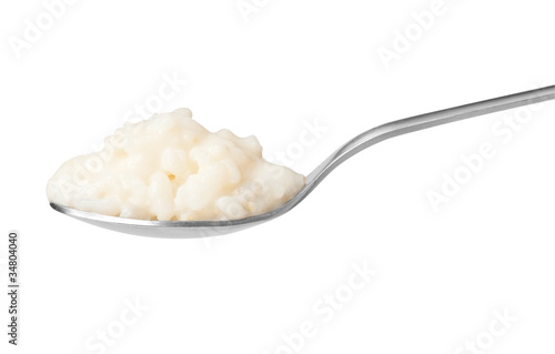 Pure rice pudding on spoon