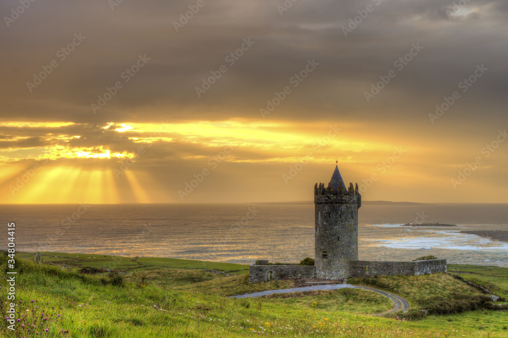 Doonagore castle at sunset in Ireland.