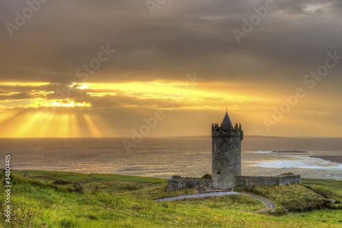 Doonagore castle at sunset in Ireland.