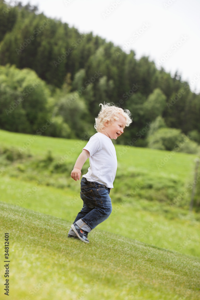 Toddler Boy Walking Alone in Garden Toddler Boy Walking Alone in Garden