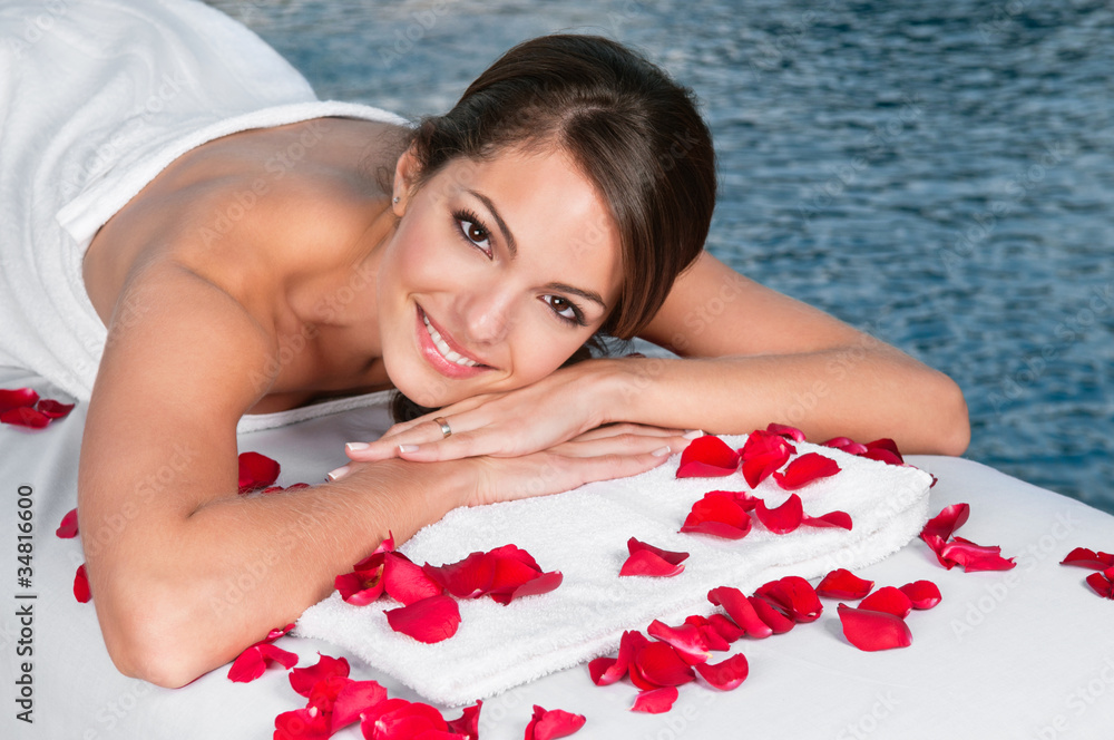 Woman lying on bed in spa Woman lying on bed in spa