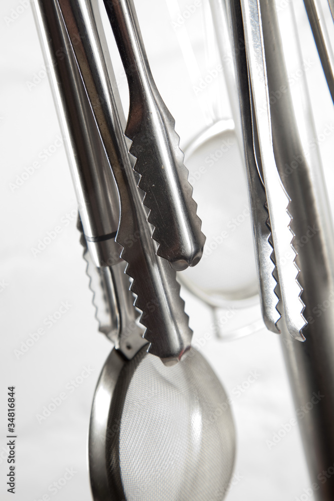 Kithcne utensils hangin in kitchen. Kithcne utensils hangin in kitchen.