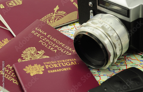 EU passports on a map with car key and camera