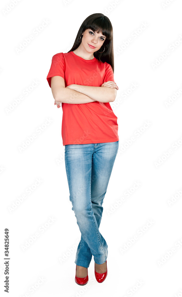 Fototapeta premium girl in red shoes and blue jeans in the studio