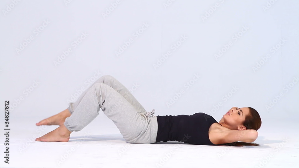 Sporty woman doing exercises on white background Sporty woman doing exercises on white background