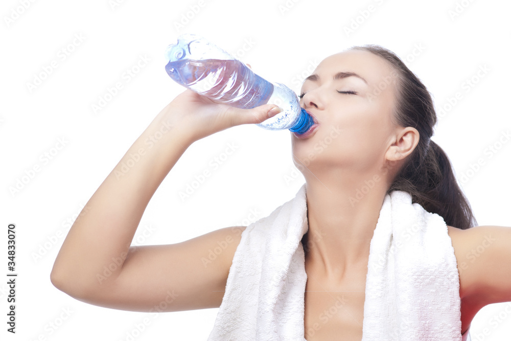 Fototapeta premium sportswoman with bottle of pure water drinking with pleasure iso